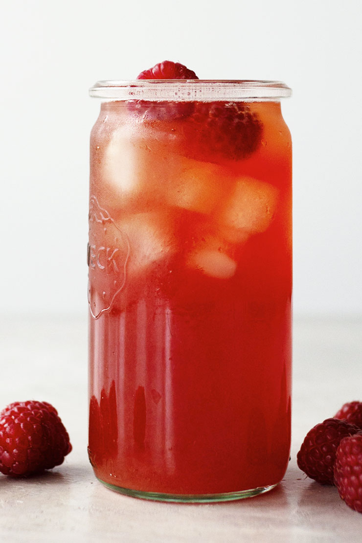 Raspberry Iced Tea in clear glass.
