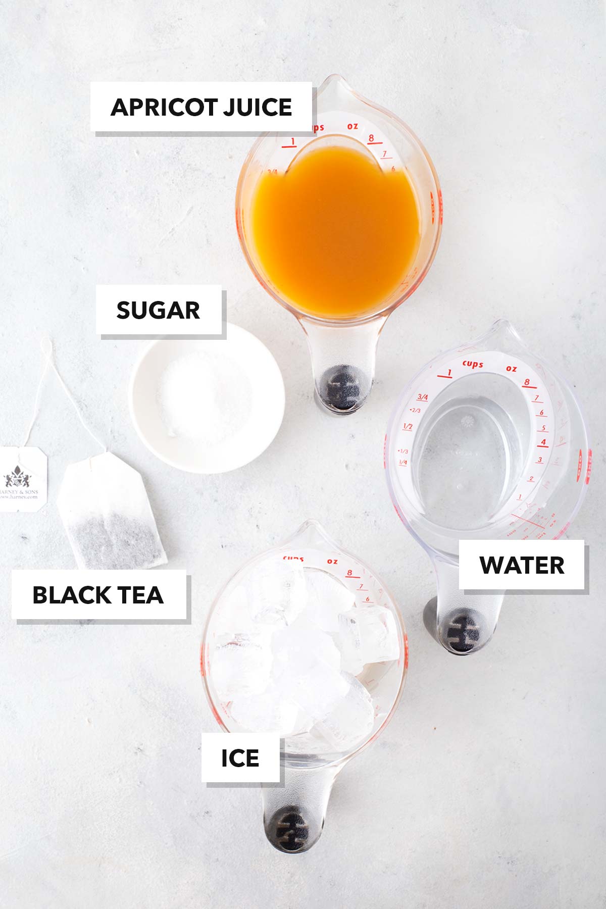 Ingredients for Apricot Iced Tea measured out in cups and bowls.