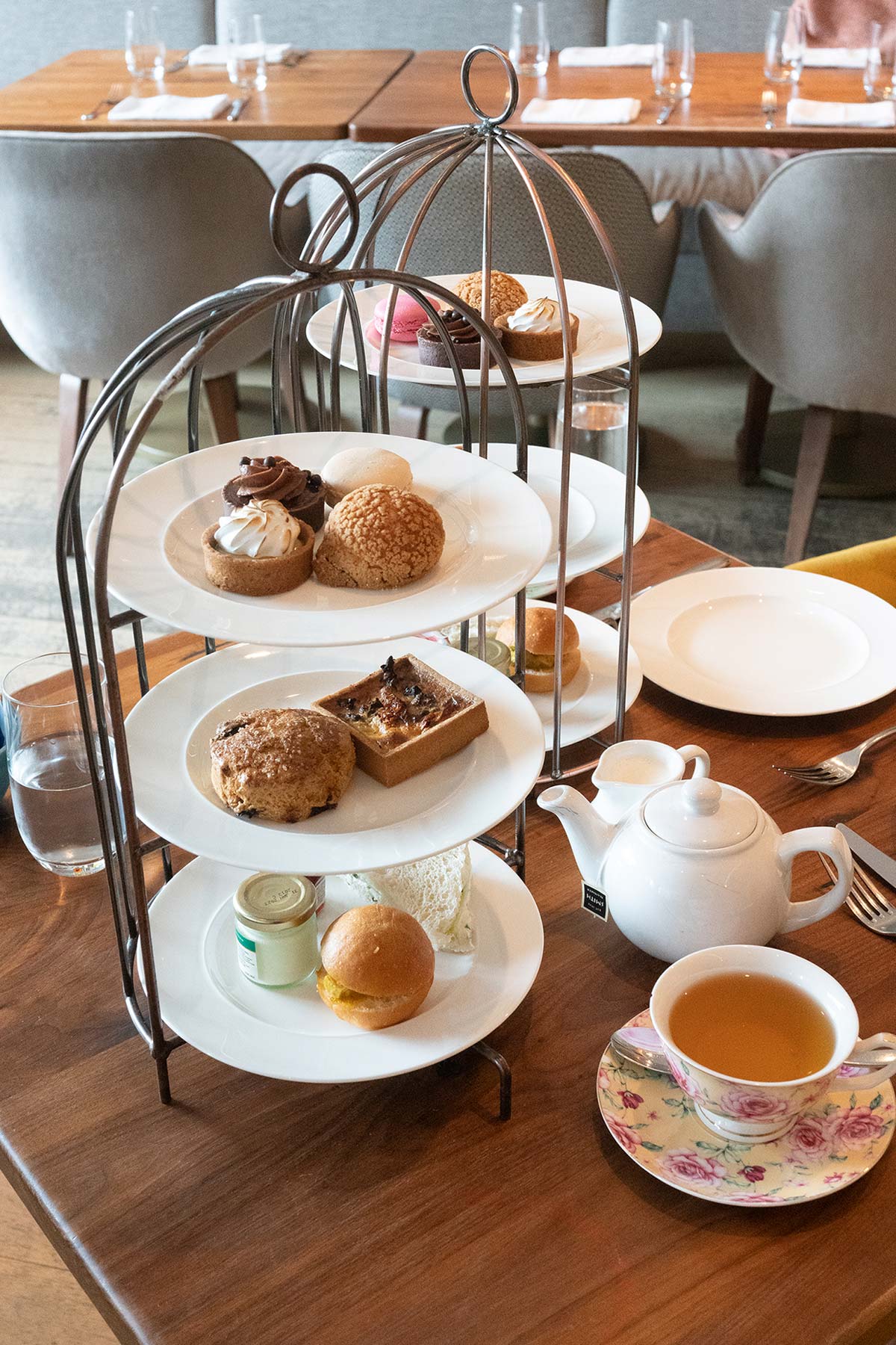 Three-tiered trays of afternoon tea courses.