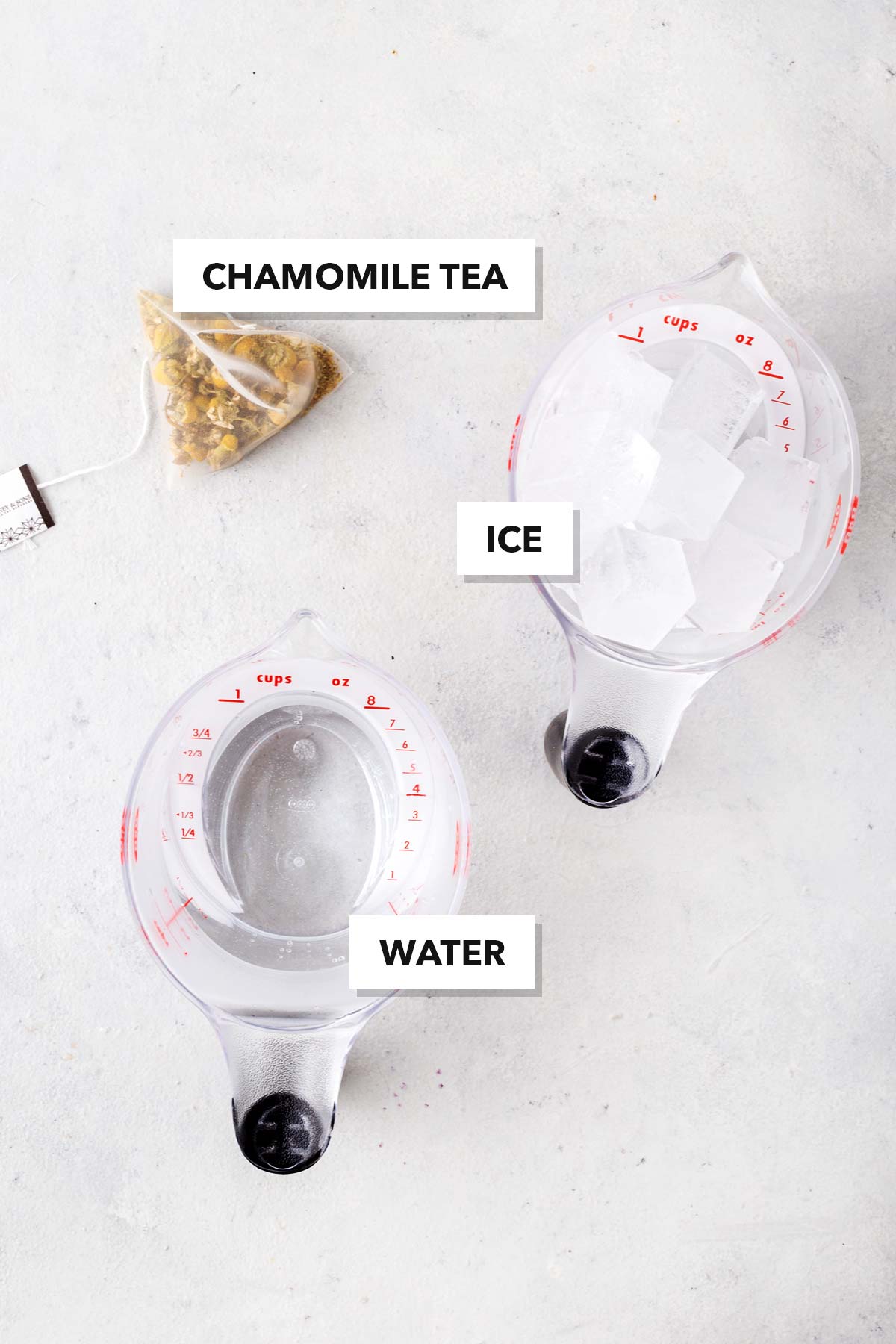 Chamomile Iced Tea ingredients measured in cups and labeled on a table.