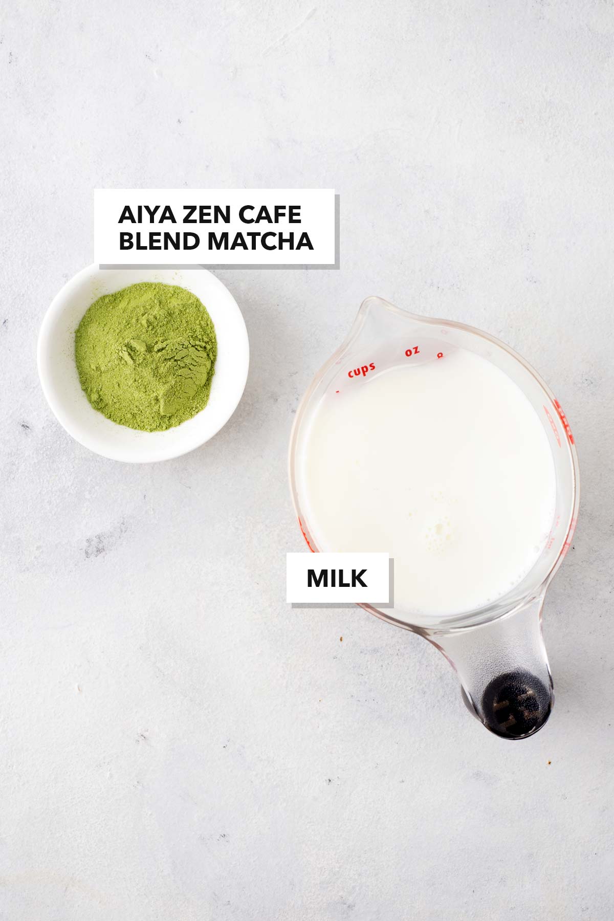 Dunkin' Matcha Latte Copycat  ingredients measured in cups and labeled on a table.