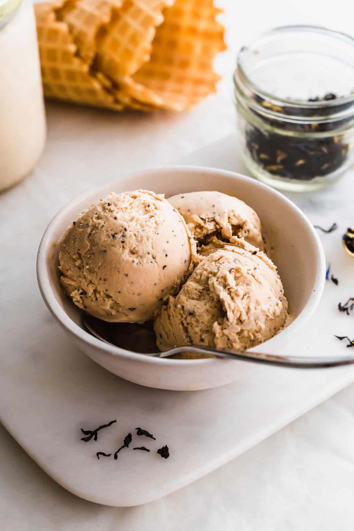 No-Churn Earl Grey Ice Cream in a bowl with a spoon.