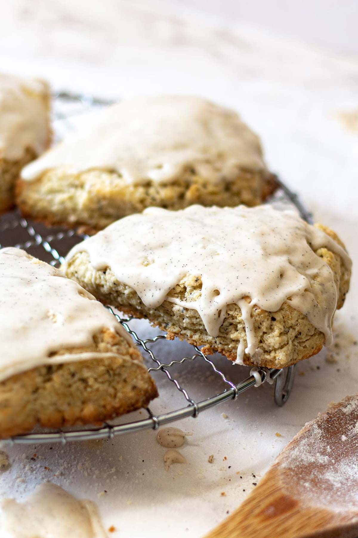 Earl Grey Scones with Vanilla Bean Glaze on a cookie cooling tray.