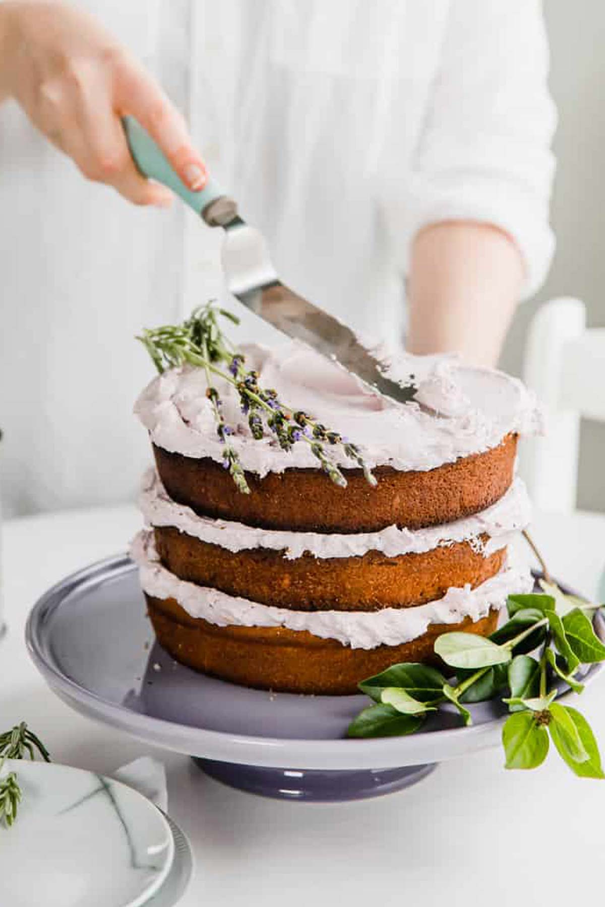 Earl Grey Lavender Cake on a cake stand.