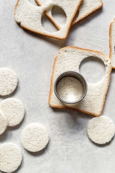 Cutting bread with a cookie cutter. 