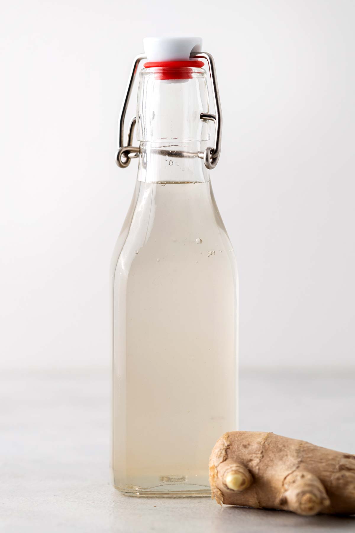 Simple Homemade Ginger Syrup in clear bottle.