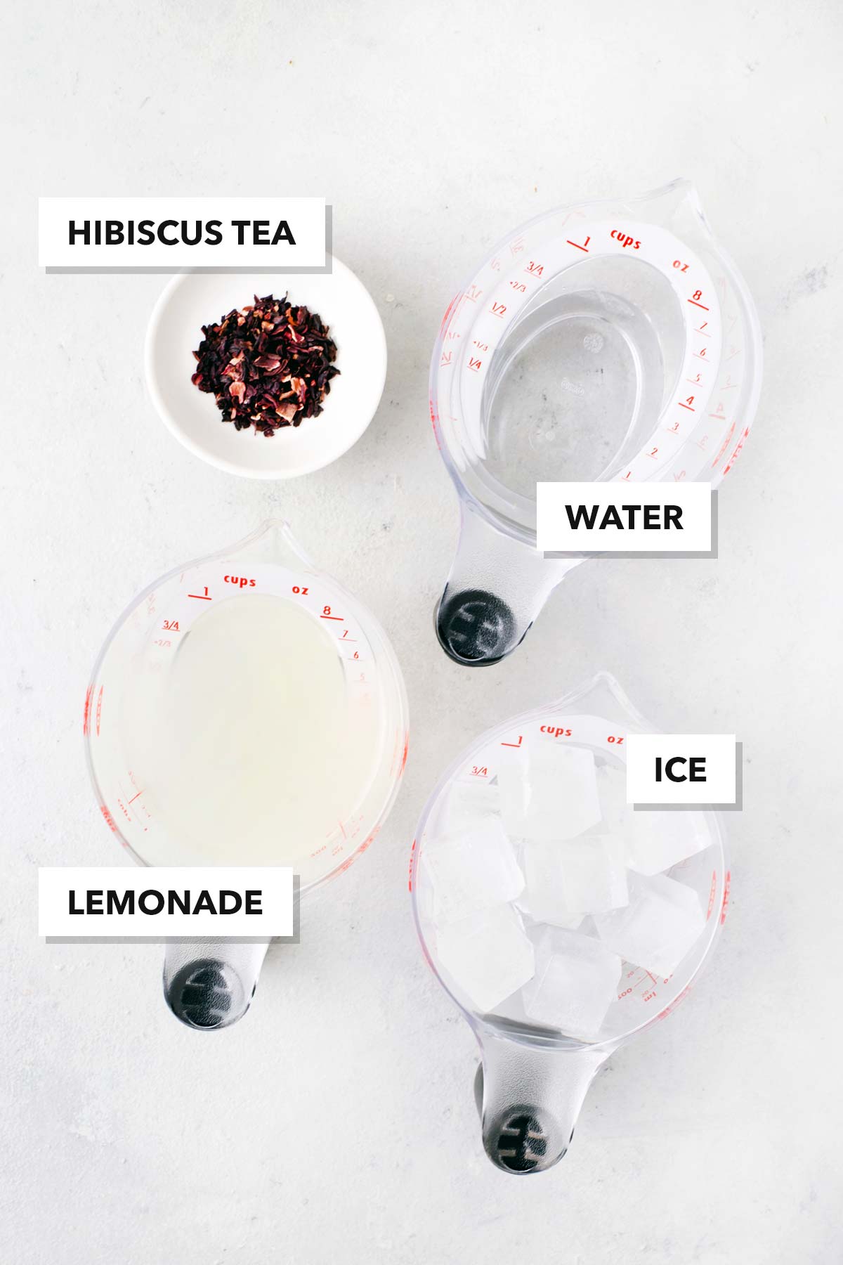 Hibiscus Lemonade ingredients measured in cups and labeled on a table.