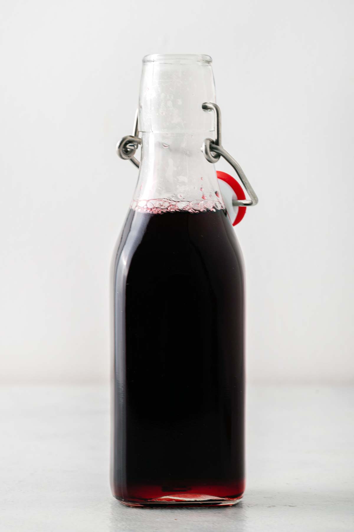 Simple Homemade Hibiscus Syrup in a bottle.