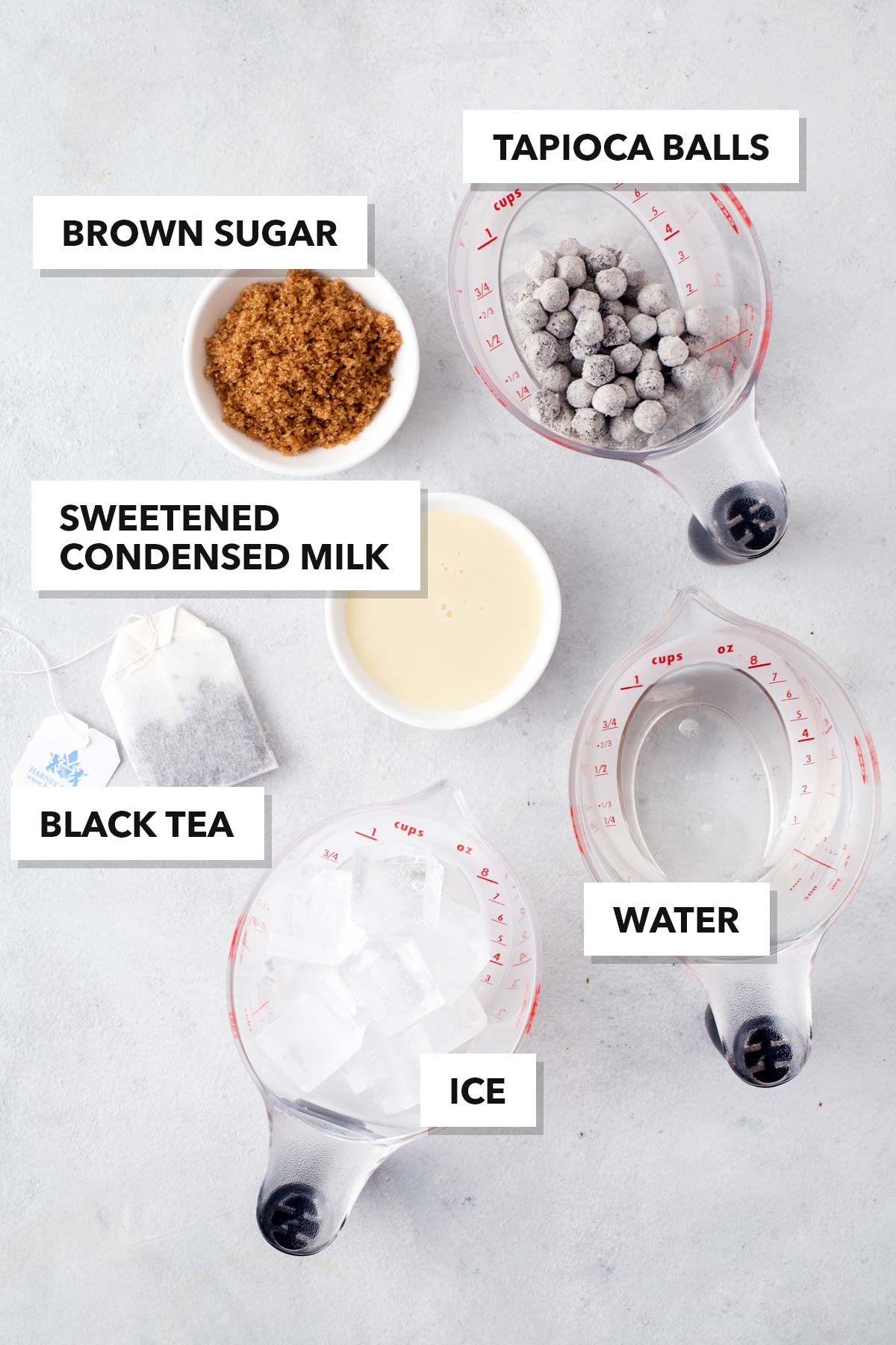Hong Kong Bubble Tea ingredients measured in cups and labeled on a table.