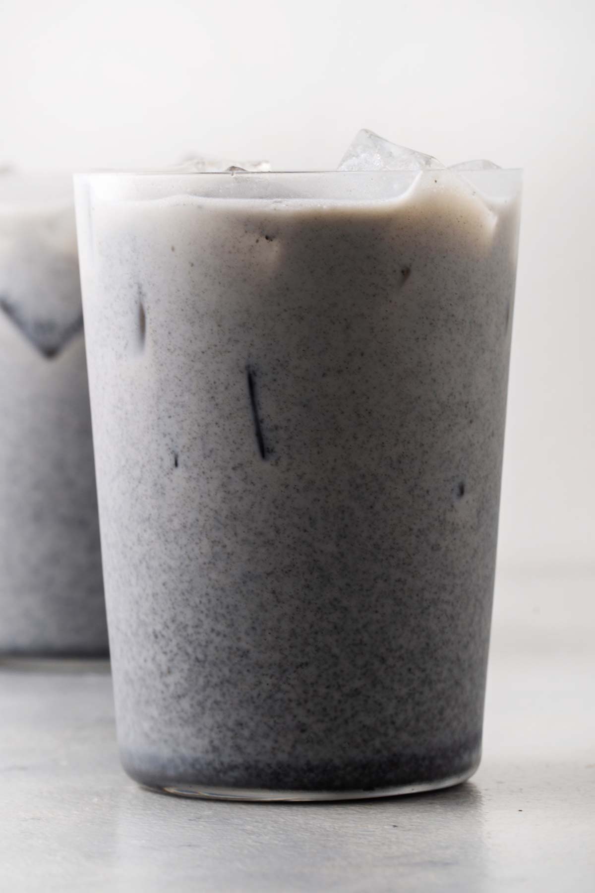 Iced Black Sesame Latte in a clear glass.