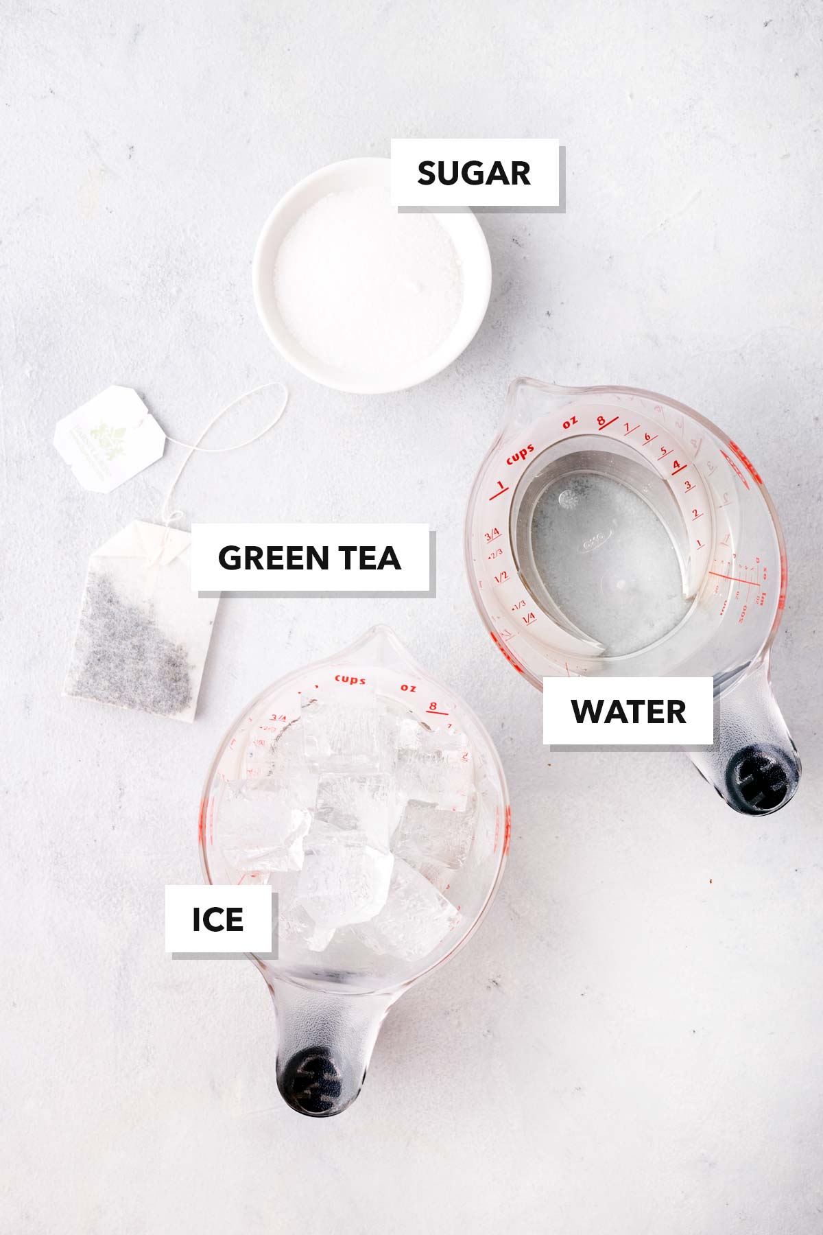 Iced Green Tea ingredients measured in cups and labeled on a table.