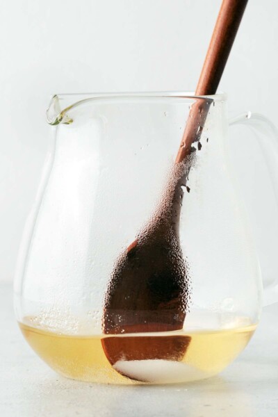 Stirring sugar into jasmine tea. 