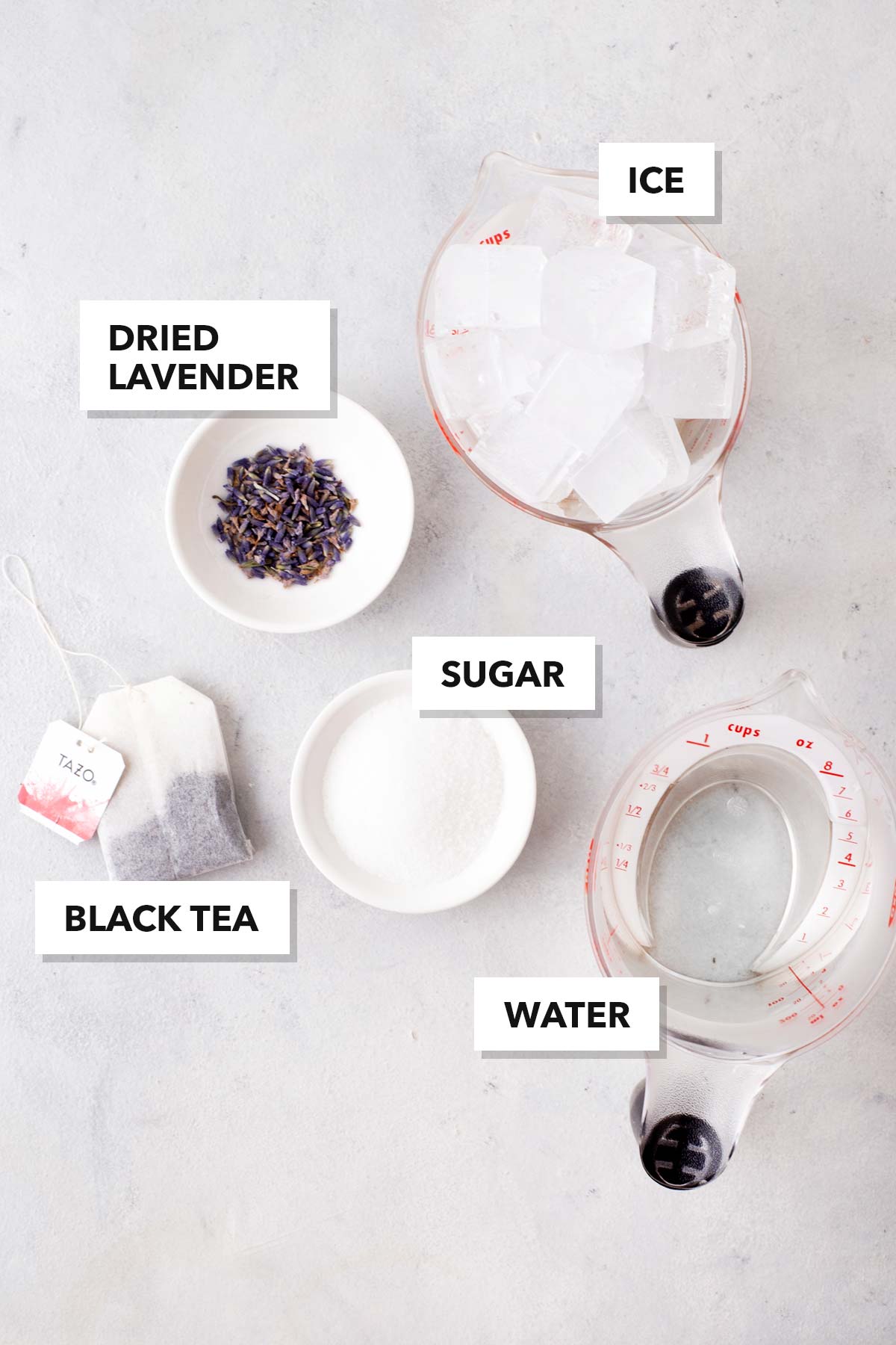 Iced Lavender Black Tea ingredients measured in cups and labeled on a table.