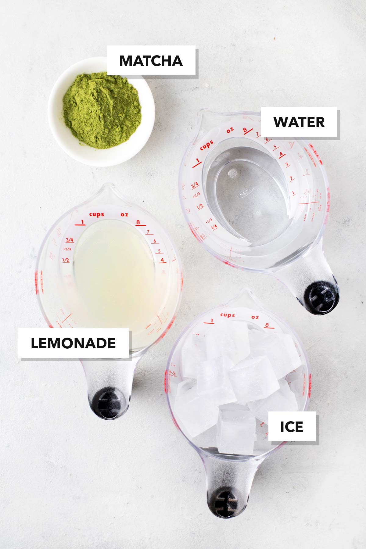 Matcha Lemonade ingredients measured in cups and labeled on a table.