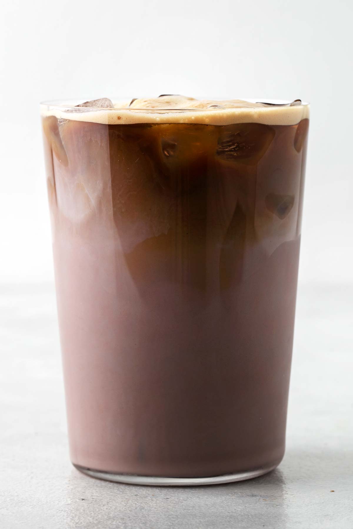 Iced protein mocha in a glass with ice.
