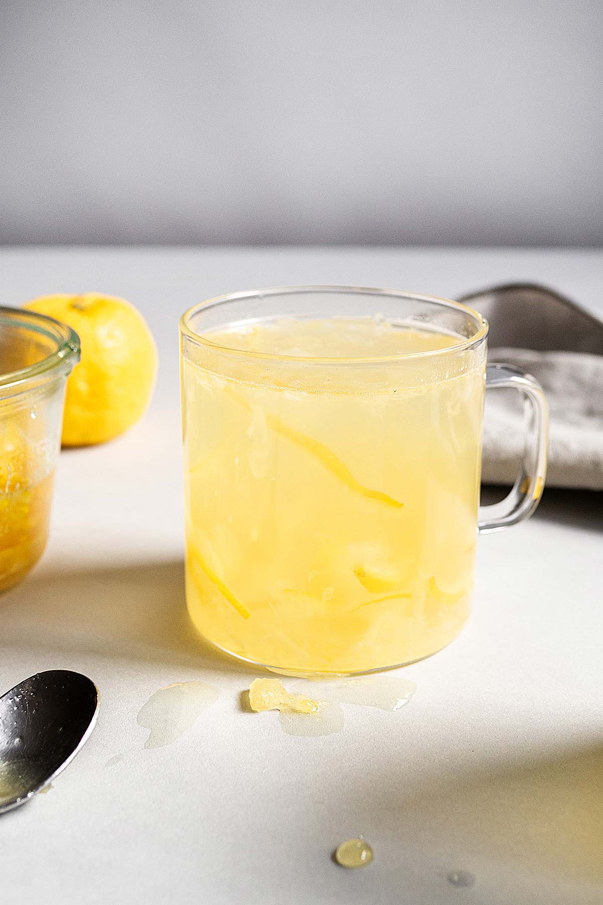 Honey Citron Tea in a glass mug.