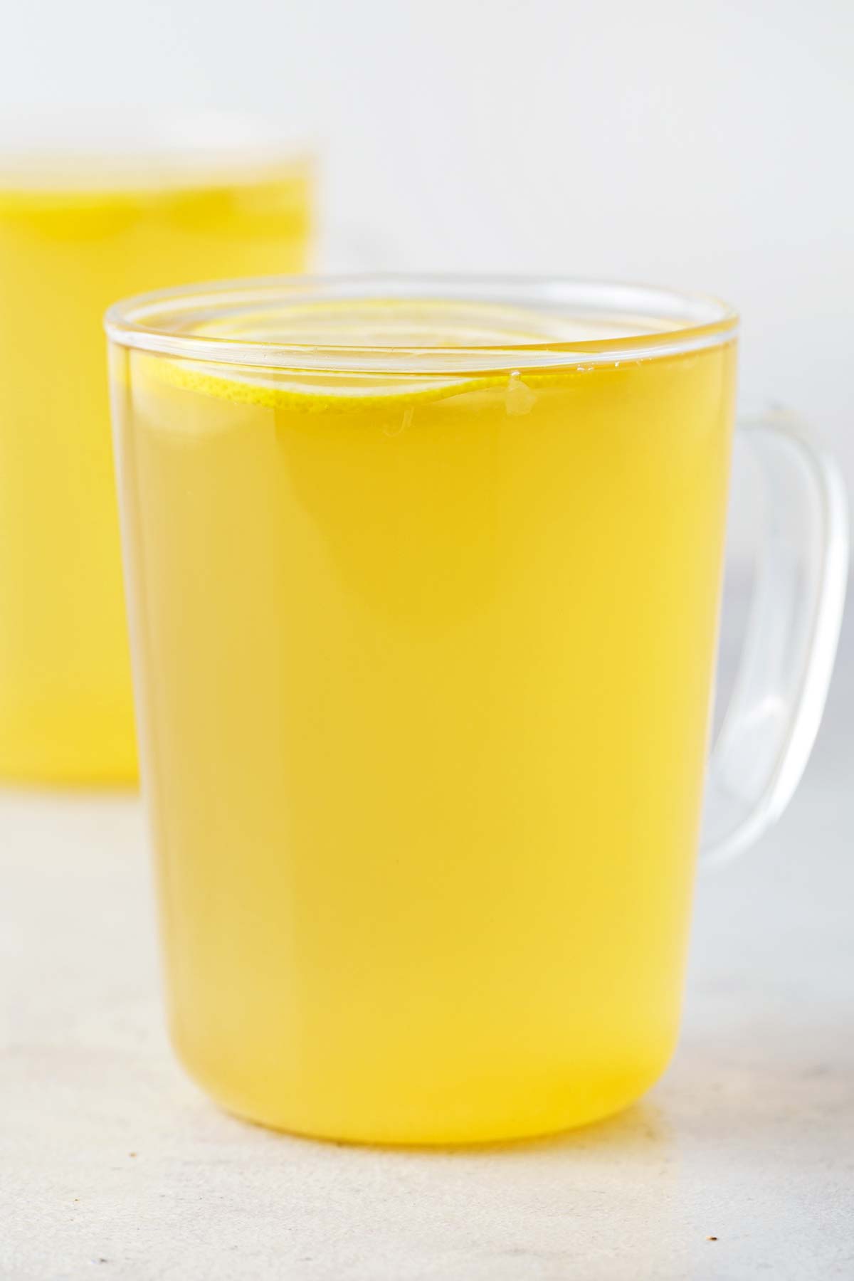 Lemon Tea in clear mug.