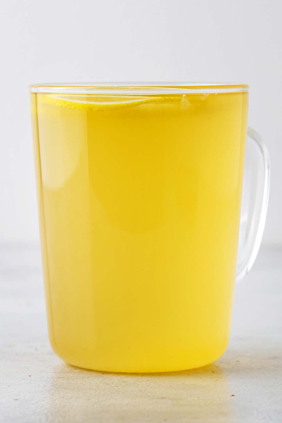 Lemon tea in a glass mug.