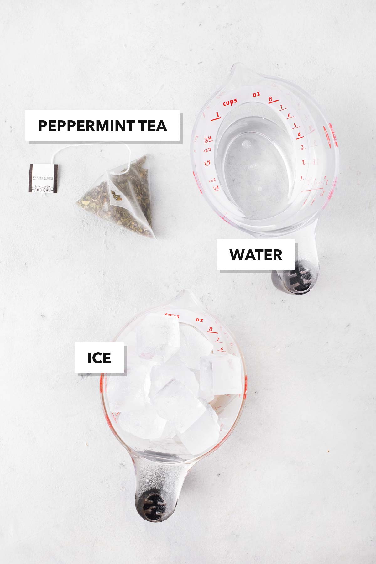 Ingredients for Mint Iced Tea measured out in bowls and cups.