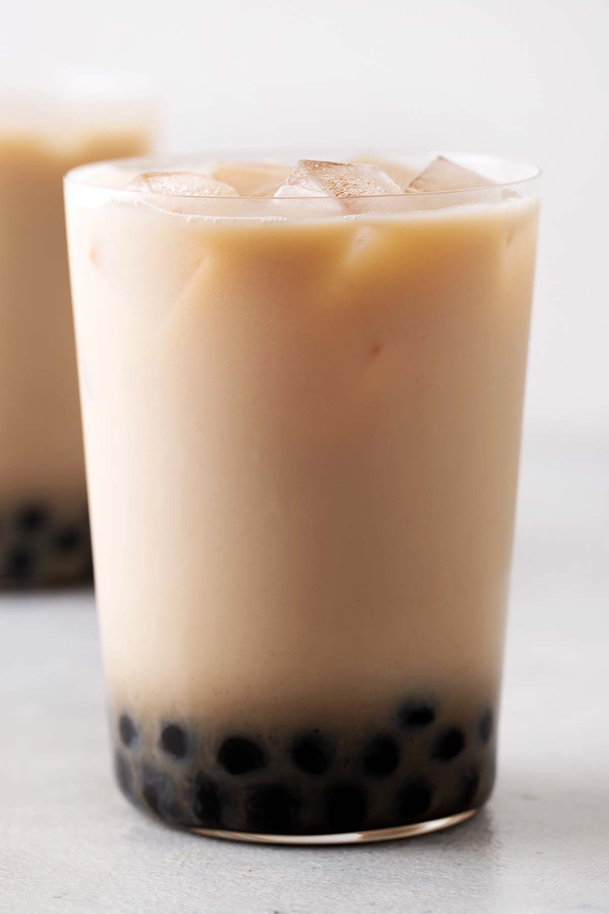 Oolong Bubble Tea fully assembled in a glass.