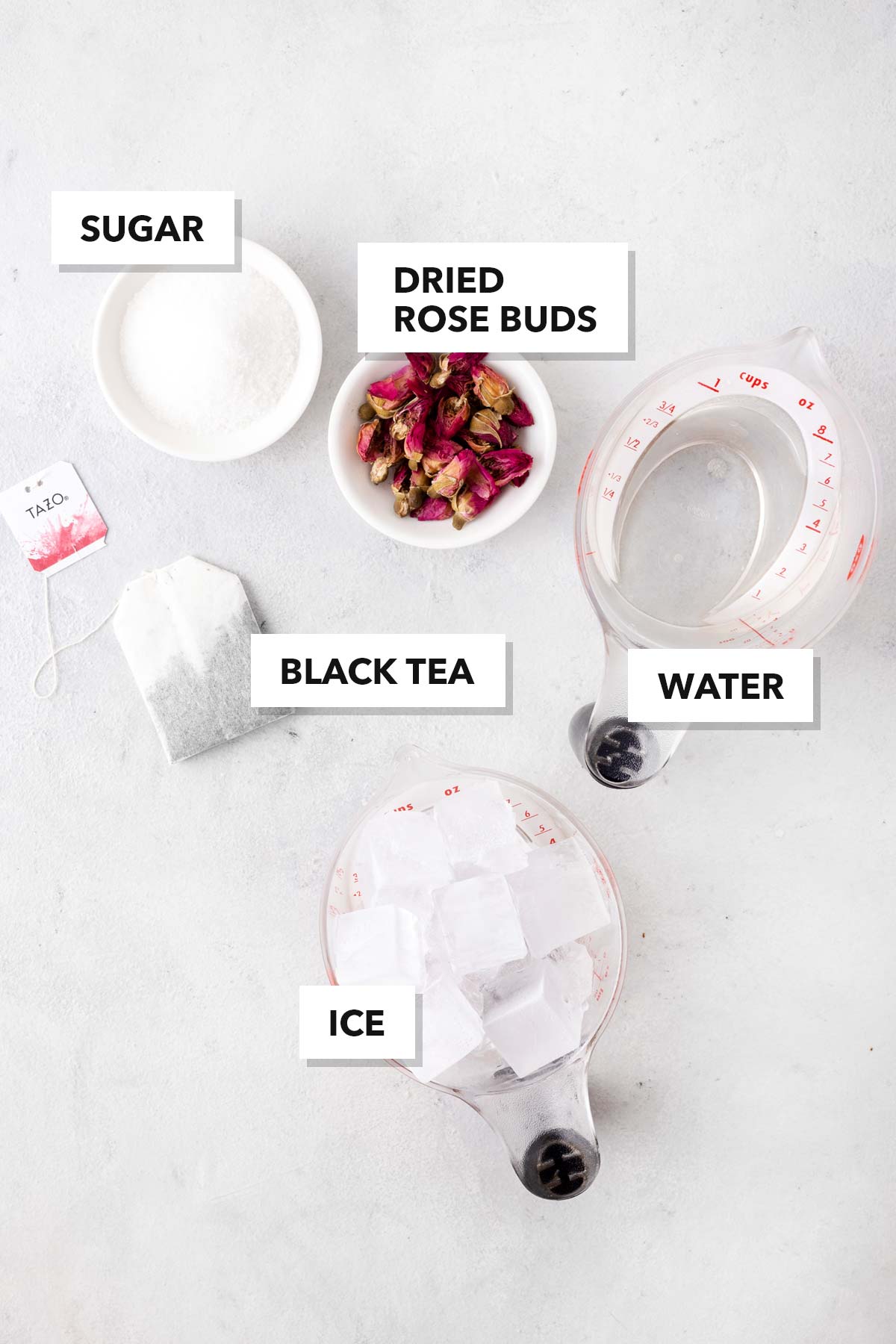 Rose Iced Tea ingredients measured in cups and labeled on a table.