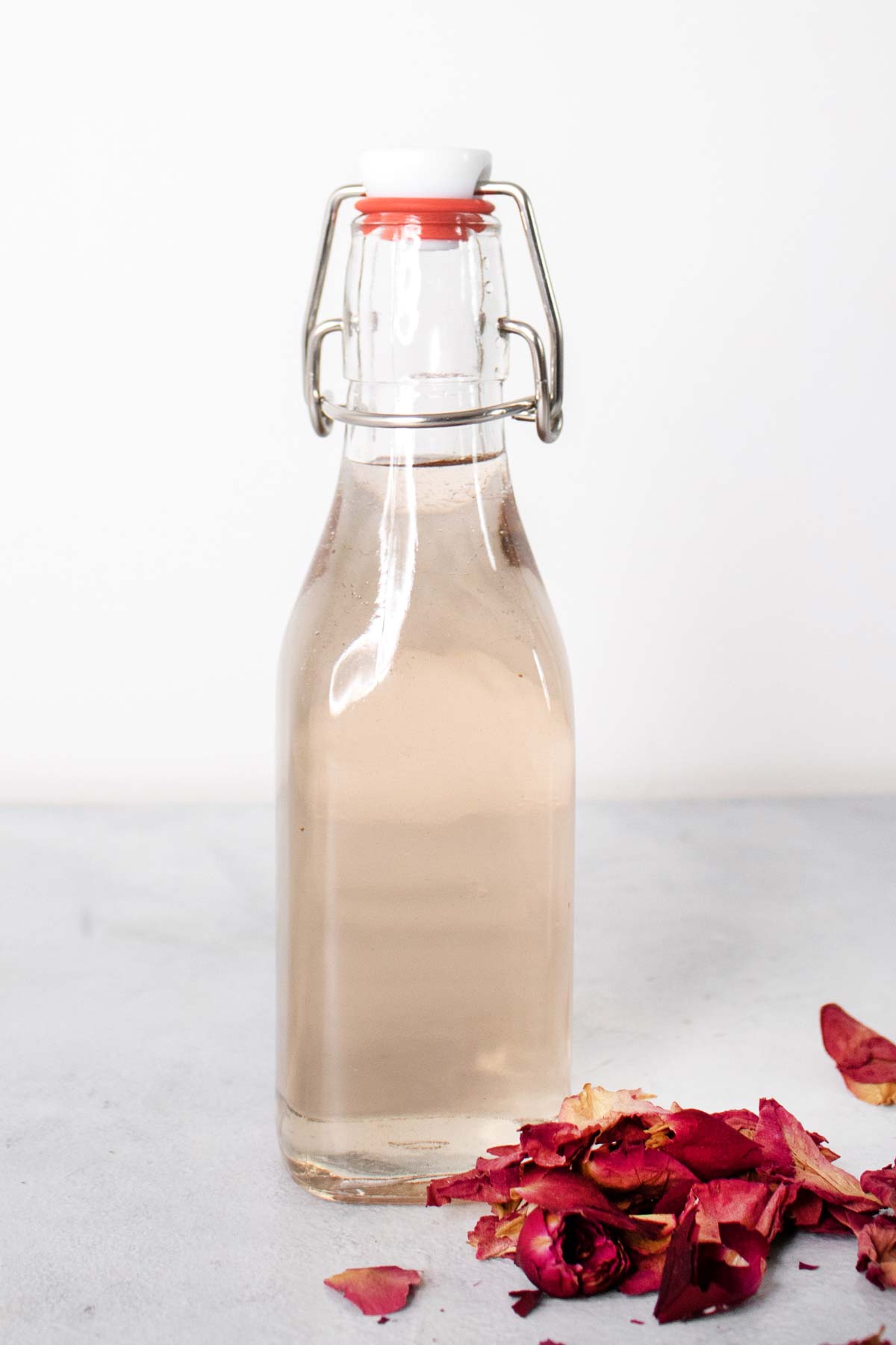 Rose syrup in a glass bottle.