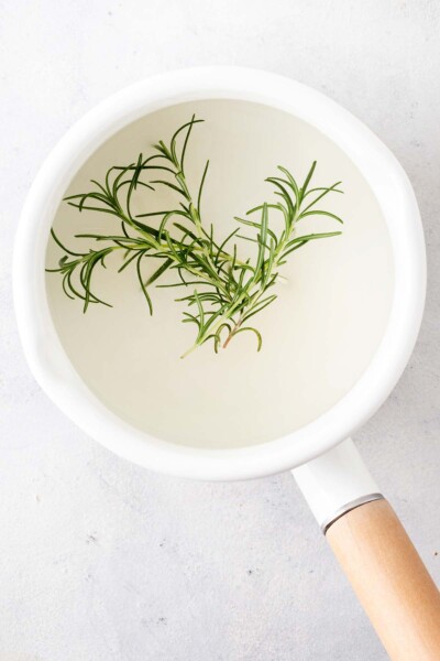 Rosemary, sugar, and water in a saucepan. 
