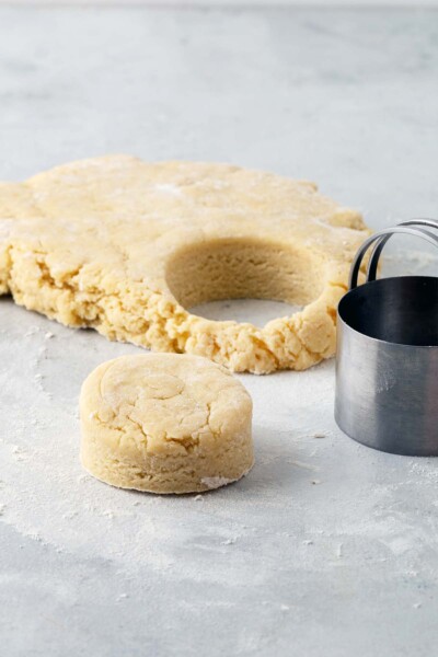 Cutting scone dough with cookie cutters. 