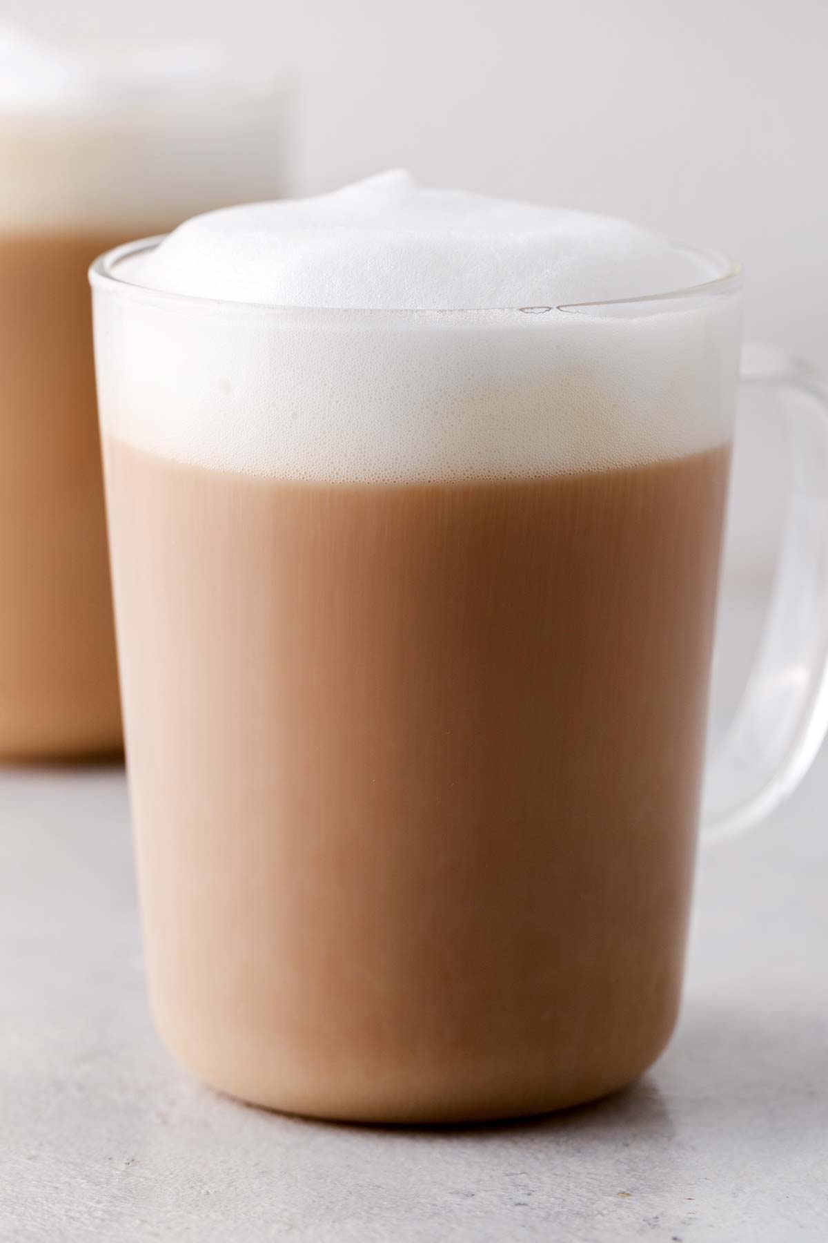 Starbucks Royal English Breakfast Tea Latte Copycat in a clear mug topped with foam.