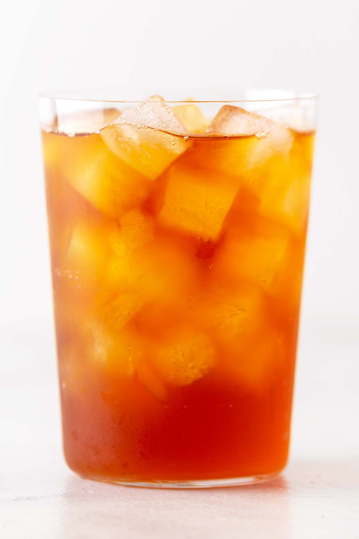 Photo of finished black iced tea with square ice cubes.