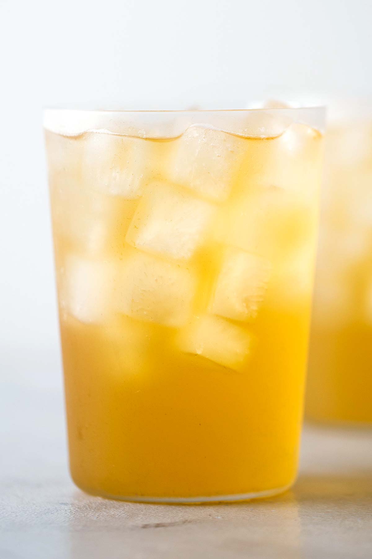 Iced green tea in a glass cup.