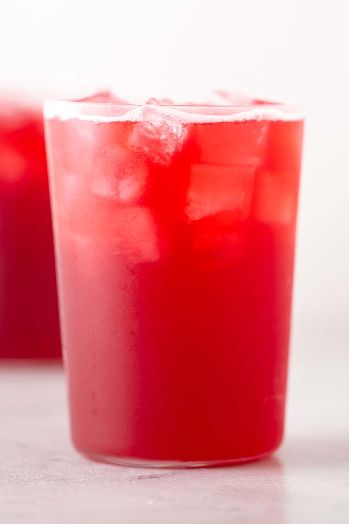 Iced passion tango tea lemonade drink in glass cups.