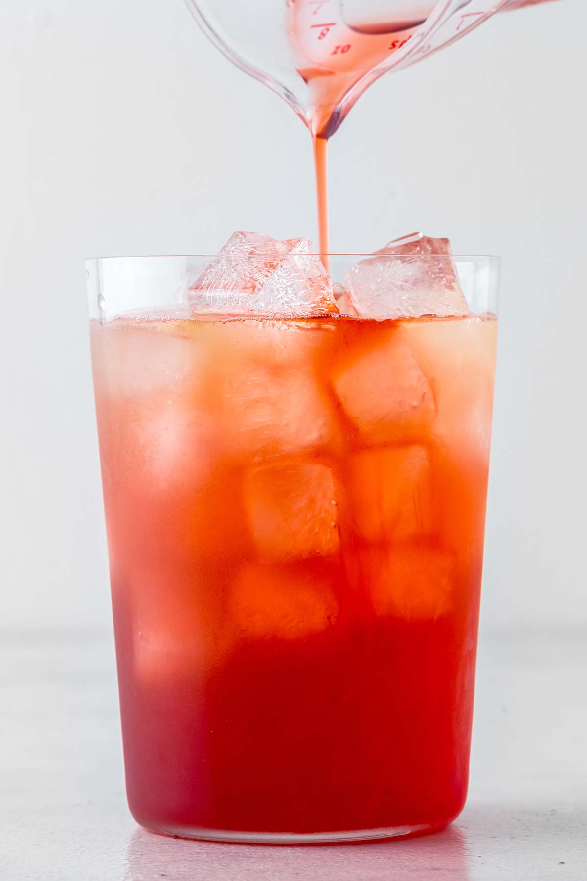 Strawberry Iced Tea in clear glass.