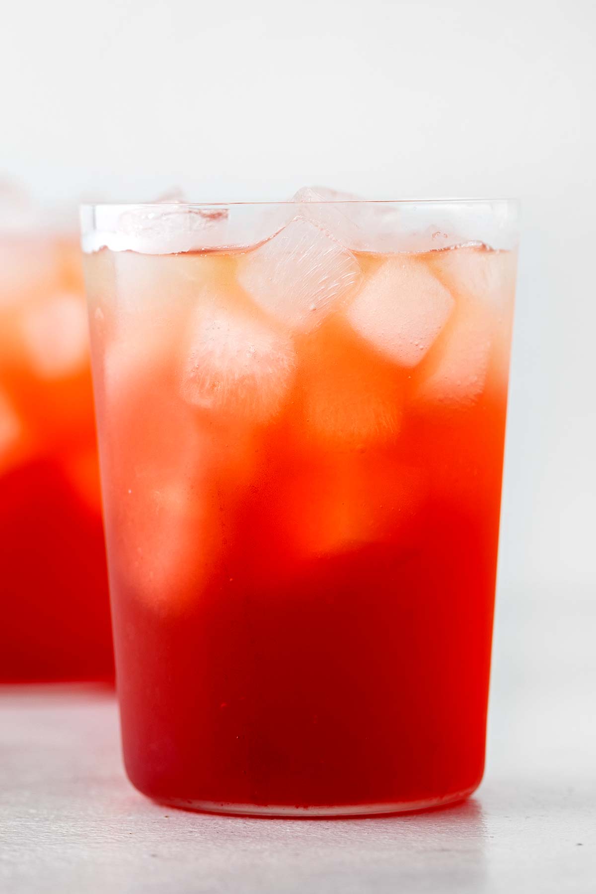Strawberry Iced Tea in clear glass.